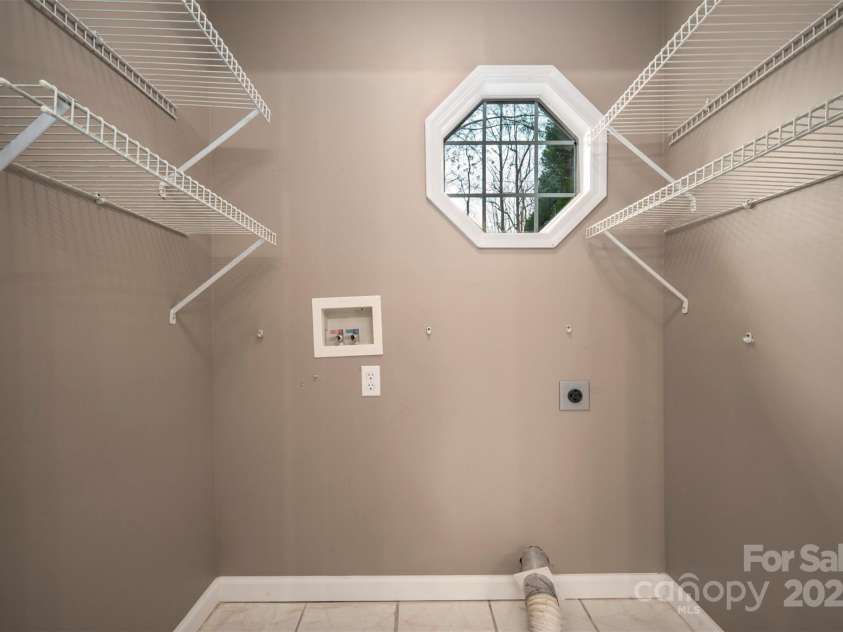 163 Woodland Drive, Columbus, NC 28722.  MLS# CAR4240701, YatesRealty ID 11111. Laundry closet in the bathroom