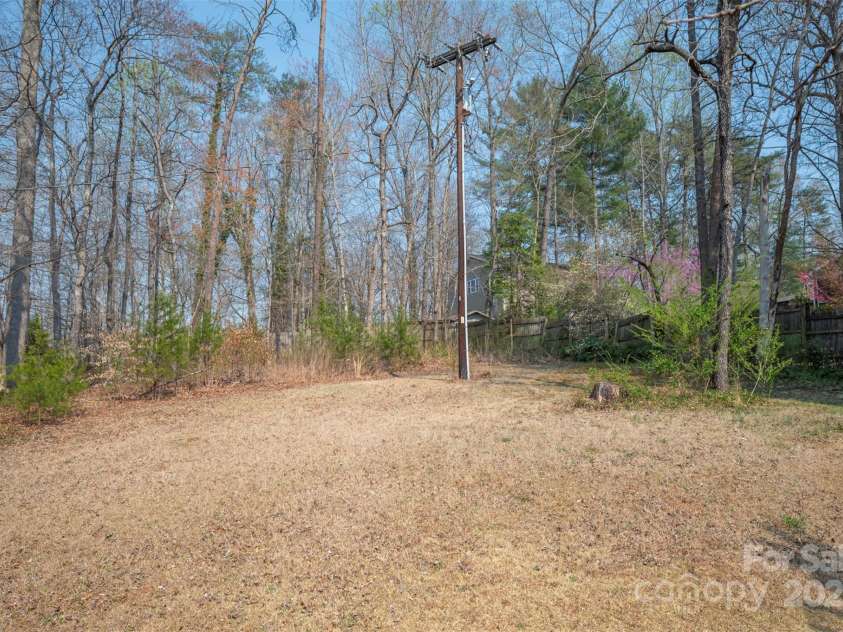 163 Woodland Drive, Columbus, NC 28722.  MLS# CAR4240701, YatesRealty ID 11111. Level back yard