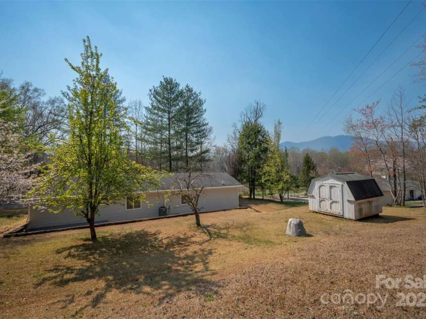 163 Woodland Drive, Columbus, NC 28722.  MLS# CAR4240701, YatesRealty ID 11111. Private well and public sewer