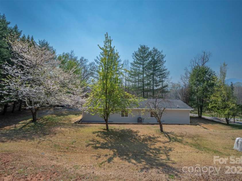 163 Woodland Drive, Columbus, NC 28722.  MLS# CAR4240701, YatesRealty ID 11111. Private well on the right