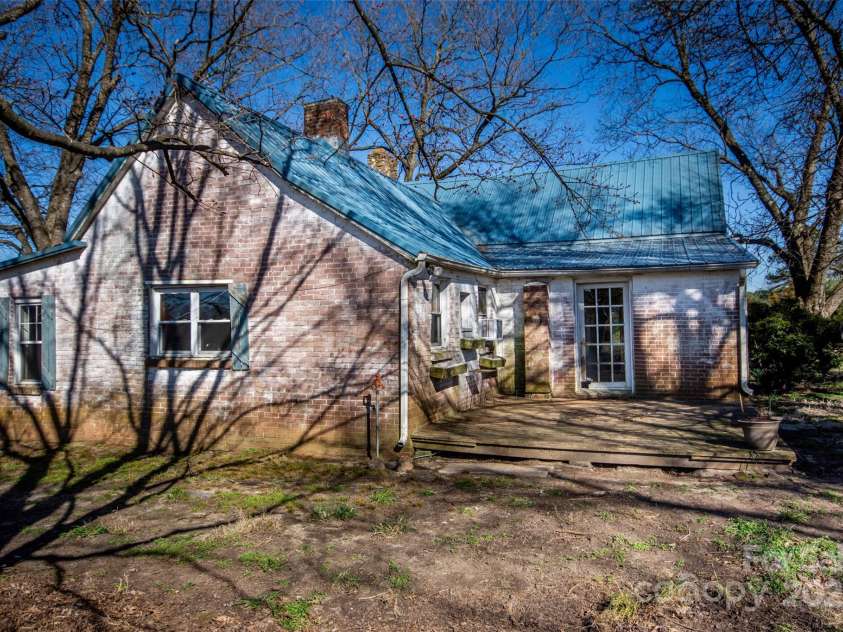 169 Eagle Mills Road, Harmony, NC 28634.  MLS# CAR4229073, YatesRealty ID 11113. Back of home and back deck