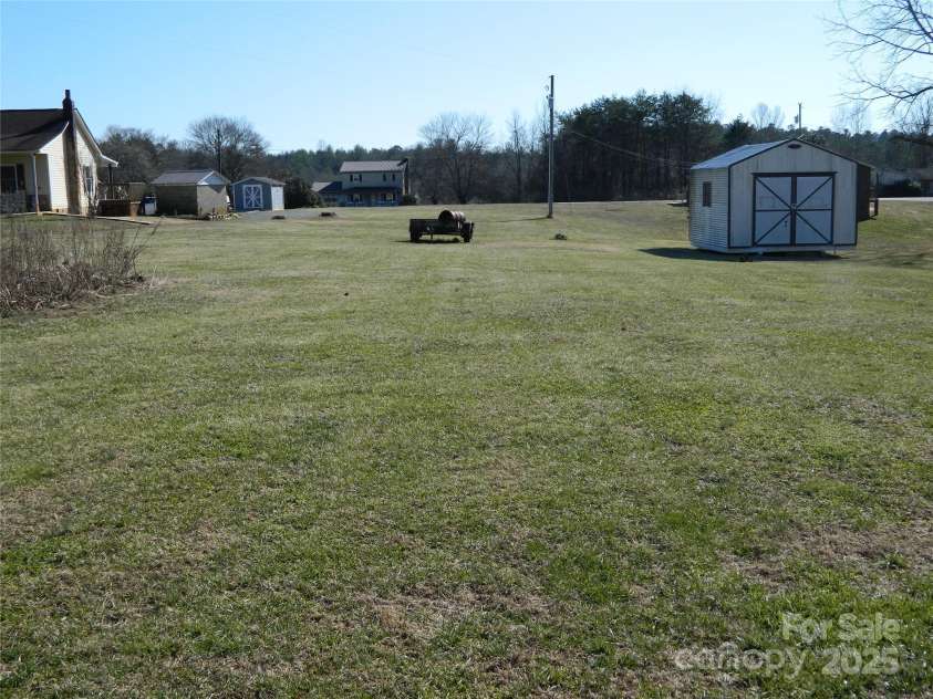 1591 Baton School Road, Granite Falls, NC 28630.  MLS# CAR4212007, YatesRealty ID 11116. Backyard and Storage Building