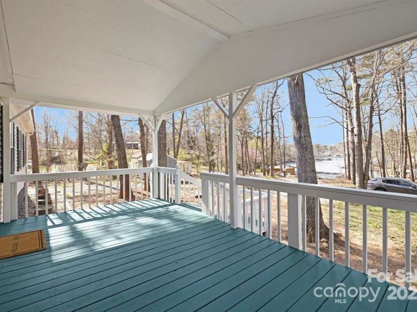 140 Sanford Lane, Badin Lake, NC 28127.  MLS# CAR4281165, YatesRealty ID 11119. Sit on This Cozy Front Porch and watch the Water!