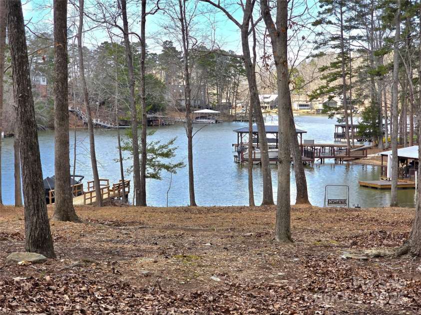 140 Sanford Lane, Badin Lake, NC 28127.  MLS# CAR4281165, YatesRealty ID 11119. WaterView!