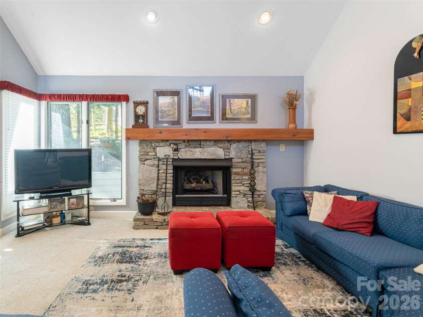 2 Bent Tree Drive, Asheville, NC 28803.  MLS# CAR4335530, YatesRealty ID 11119. Stone hearth with gas logs