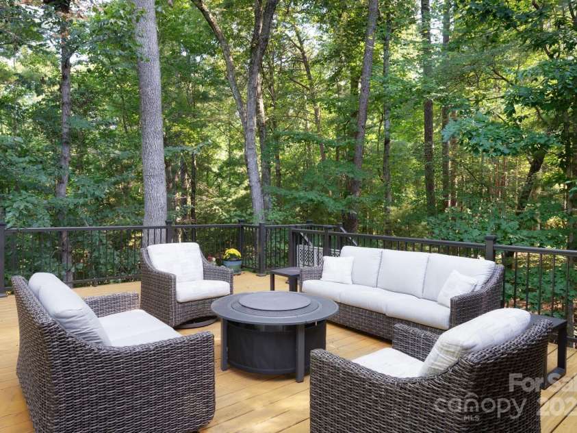 6 LaRue Court, Biltmore Lake, NC 28715.  MLS# CAR4176289, YatesRealty ID 11123. Relaxing on back porch