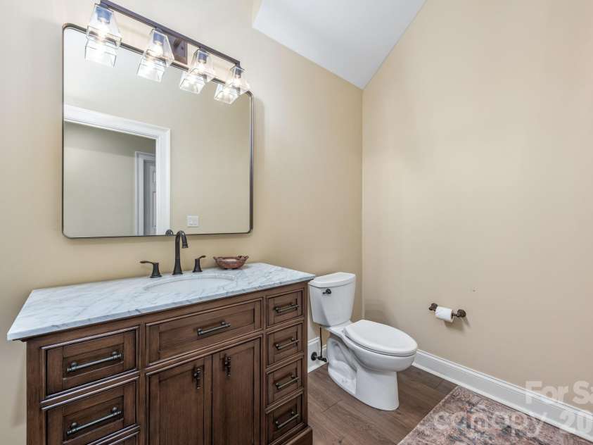 946 Laurel Creek Lane, Charlotte, NC 28211.  MLS# CAR4298519, YatesRealty ID 1113. Powder room in basement next to gym