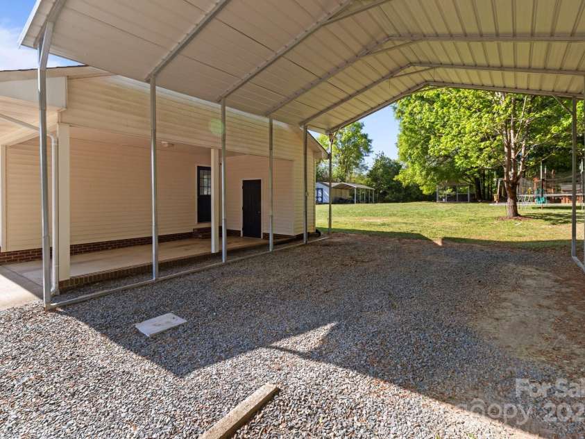 1238 Moss Springs Road, Albemarle, NC 28001.  MLS# CAR4248071, YatesRealty ID 11135. Detached Double Carport