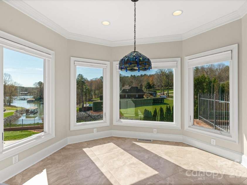 5809 Selkirk Drive, Hickory, NC 28601.  MLS# CAR4235652, YatesRealty ID 11140. Breakfast area with pool and lake views