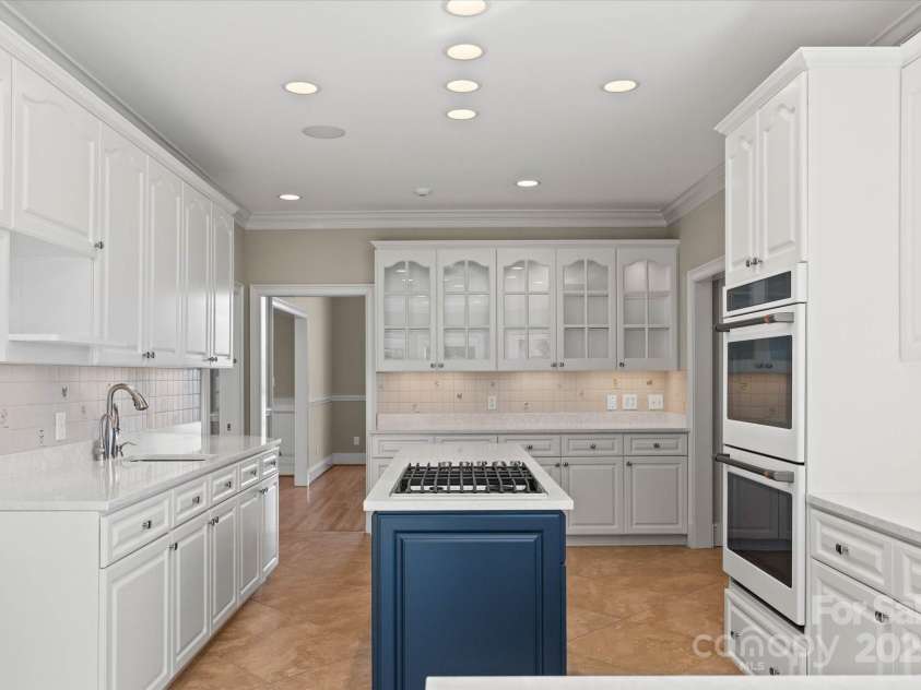 5809 Selkirk Drive, Hickory, NC 28601.  MLS# CAR4235652, YatesRealty ID 11140. Main level kitchen with pantry