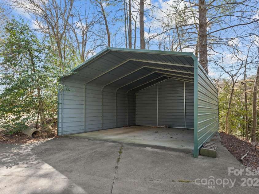 5809 Selkirk Drive, Hickory, NC 28601.  MLS# CAR4235652, YatesRealty ID 11140. Shed near boat dock