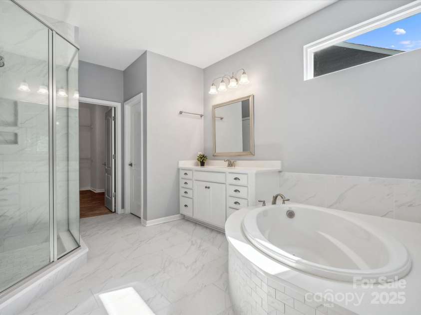 11931 The Ramble Drive, Huntersville, NC 28078.  MLS# CAR4252530, YatesRealty ID 11141. Main Floor Primary Bathroom