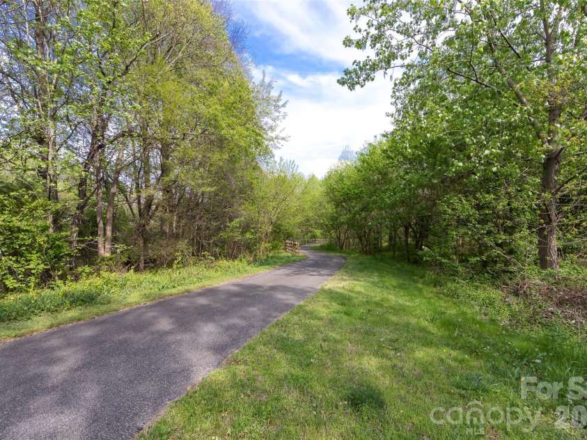 9145 Mcdowell Creek Court, Cornelius, NC 28031.  MLS# CAR4336946, YatesRealty ID 11148. Community Walking Trail!