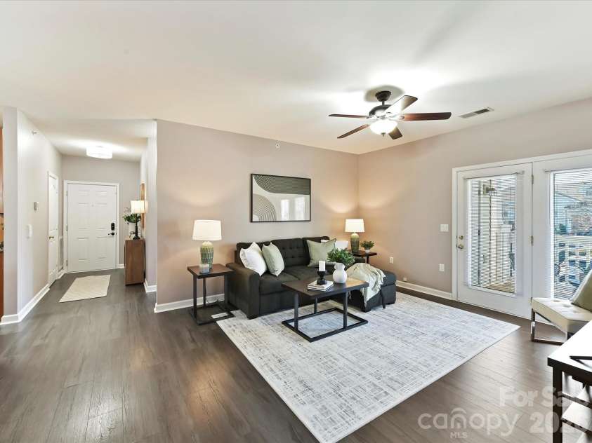 9145 Mcdowell Creek Court, Cornelius, NC 28031.  MLS# CAR4336946, YatesRealty ID 11148. Great Room offers ceiling fan/light & covered balcony access!