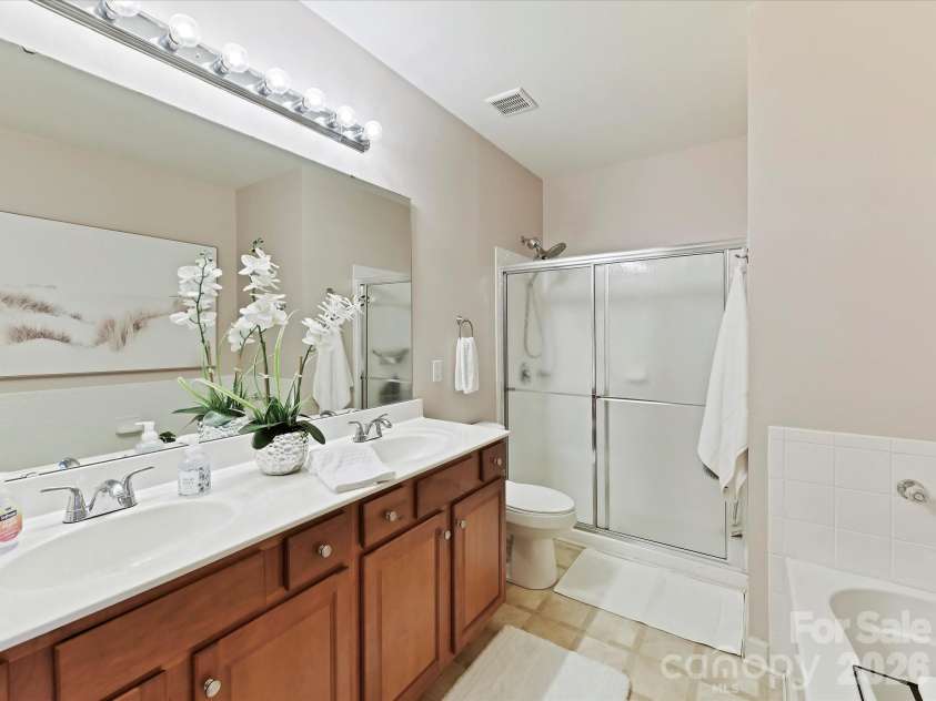 9145 Mcdowell Creek Court, Cornelius, NC 28031.  MLS# CAR4336946, YatesRealty ID 11148. Primary Bath features dual vanity, garden tub & separate shower!