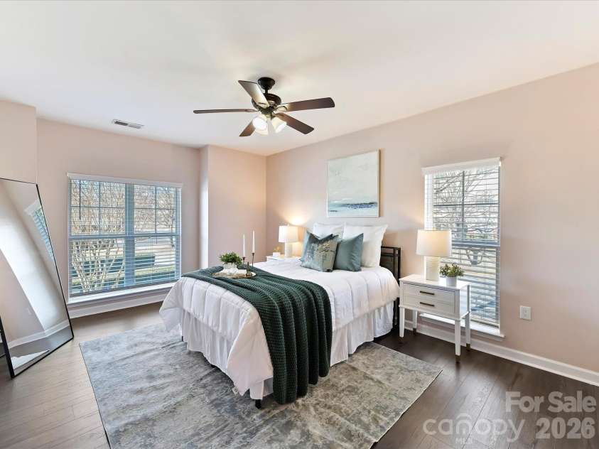 9145 Mcdowell Creek Court, Cornelius, NC 28031.  MLS# CAR4336946, YatesRealty ID 11148. Spacious Primary Suite with ceiling fan/light, private bath & walk in closet with closet system!