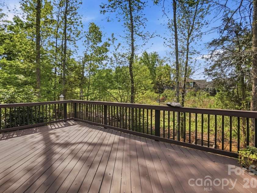11010 Sparkle Creek Drive, Midland, NC 28107.  MLS# CAR4361341, YatesRealty ID 11151. Beautiful deck looking out to the trees