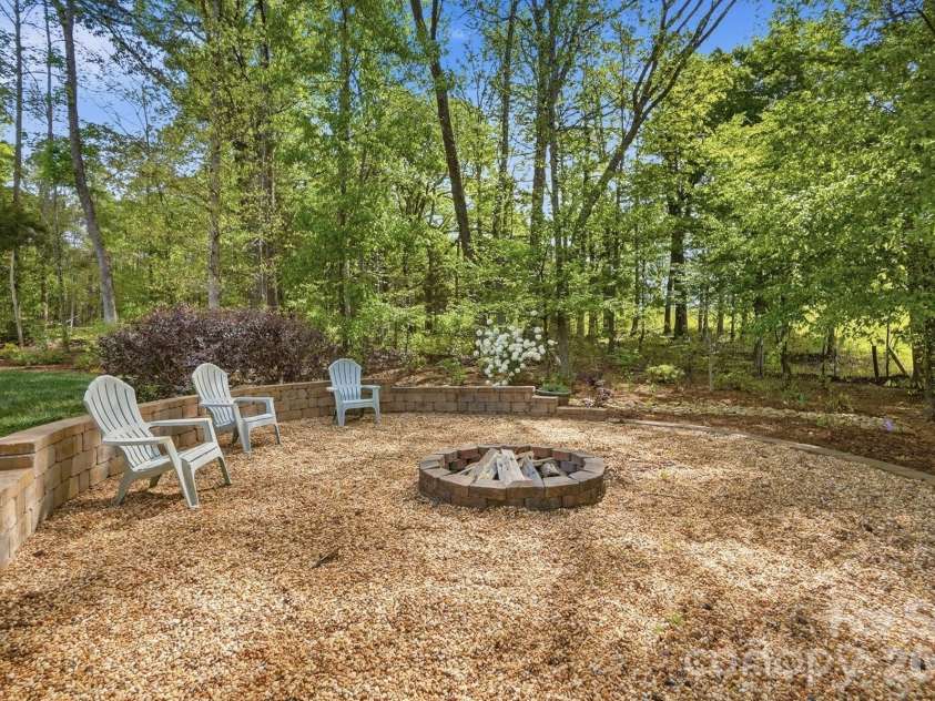 11010 Sparkle Creek Drive, Midland, NC 28107.  MLS# CAR4361341, YatesRealty ID 11151. Custom firepit