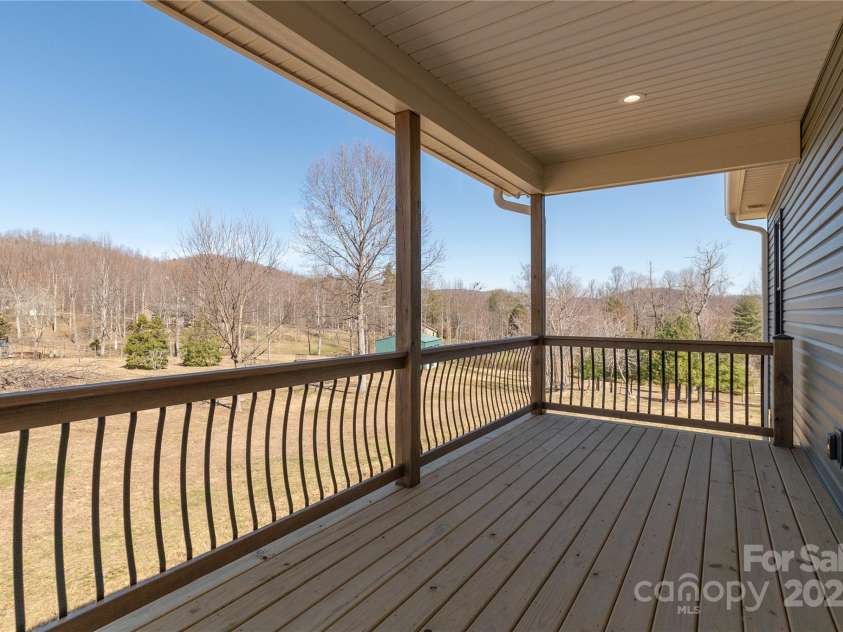 126 Whiskey River Run, Hendersonville, NC 28792.  MLS# CAR4205245, YatesRealty ID 11156. Back covered porch
