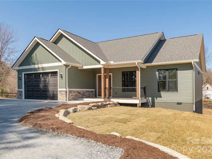 126 Whiskey River Run, Hendersonville, NC 28792.  MLS# CAR4205245, YatesRealty ID 11156. Drive in front of garage to be paved prior to closing