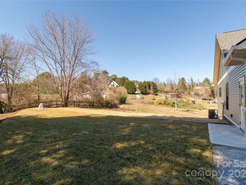 126 Whiskey River Run, Hendersonville, NC 28792.  MLS# CAR4205245, YatesRealty ID 11156. Left side yard