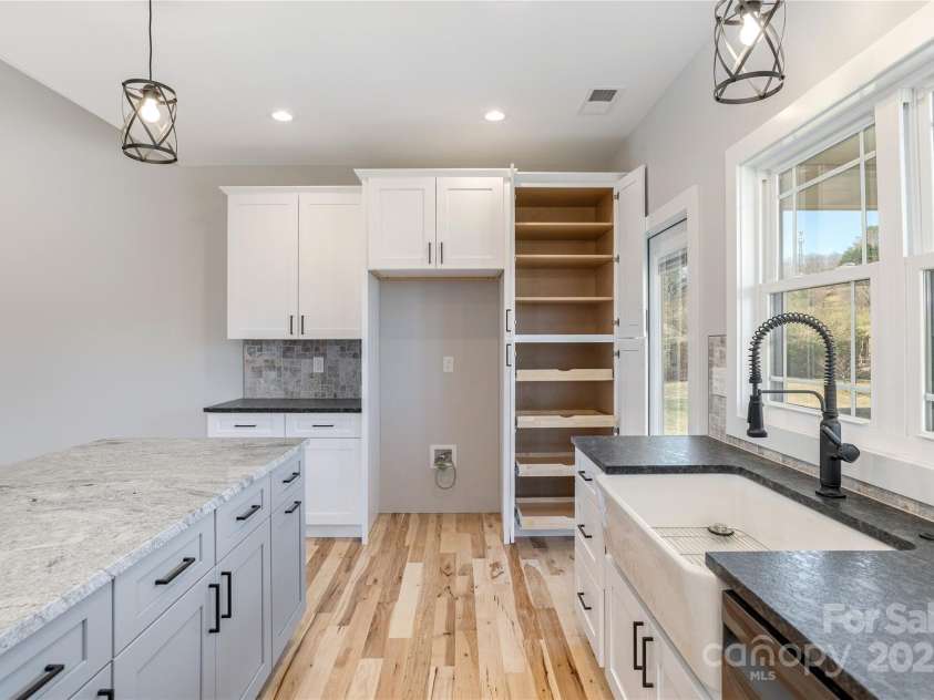 126 Whiskey River Run, Hendersonville, NC 28792.  MLS# CAR4205245, YatesRealty ID 11156. Pantry cabinet with rollouts