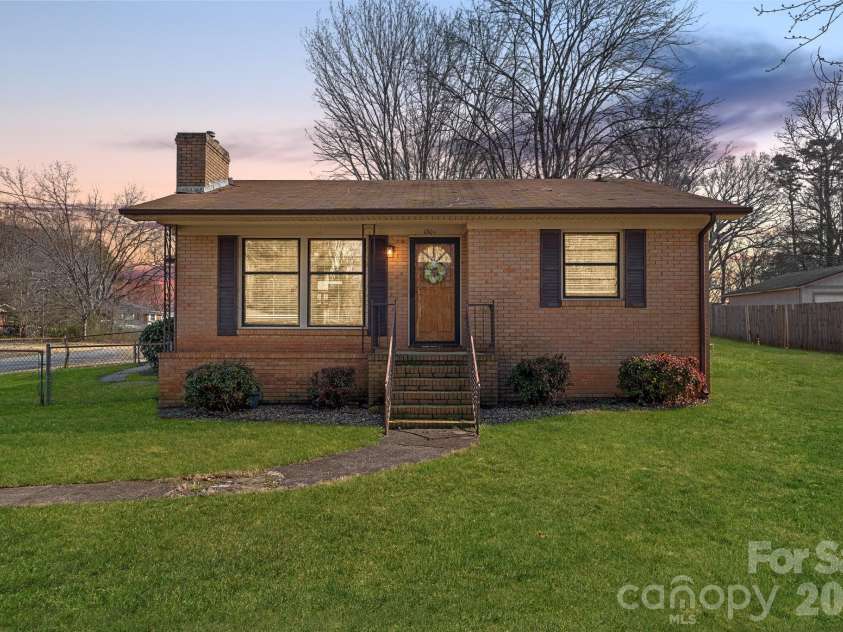 1301 Lane Road, Mount Holly, NC 28120.  MLS# CAR4348932, YatesRealty ID 11160. Front exterior at dusk. *Photo has been virtually enhanced.*