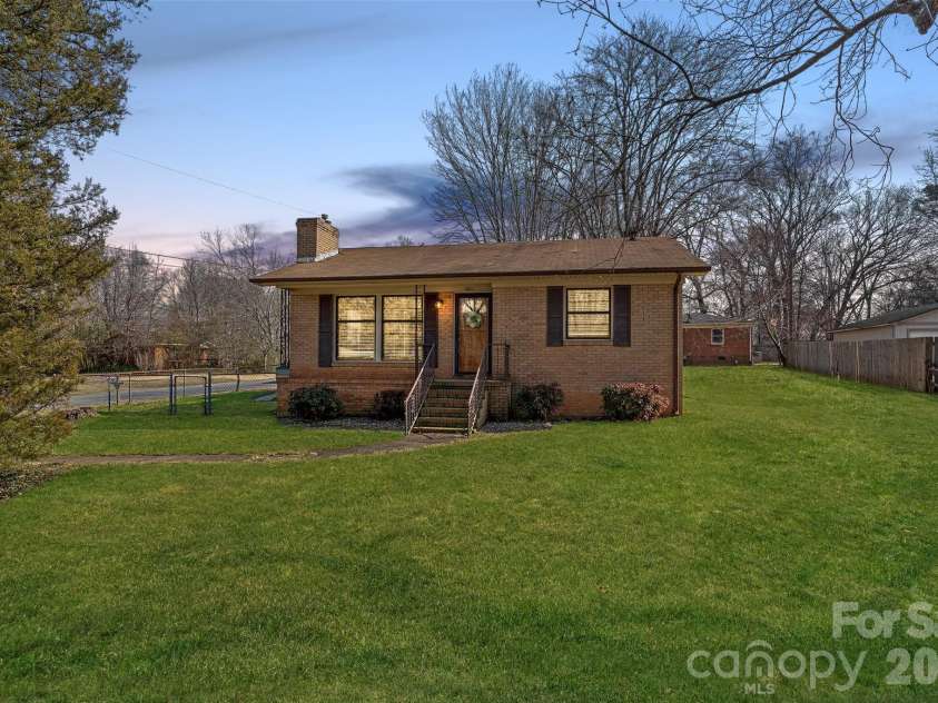 1301 Lane Road, Mount Holly, NC 28120.  MLS# CAR4348932, YatesRealty ID 11160. Front exterior at dusk. *Photo has been virtually enhanced.*