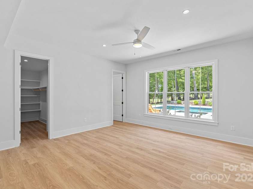 2010 Bessbrook Road, Fort Mill, SC 29708.  MLS# CAR4284508, YatesRealty ID 11165. Bedroom #5 in the basement overlooking the pool.