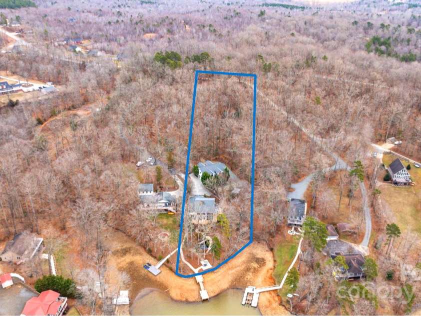 122 Mountain Harbor Drive, Lexington, NC 27292.  MLS# CAR4217597, YatesRealty ID 11172. HUGE 3+ acre lot! Temporary lake draw down of almost 8 ft below pond.