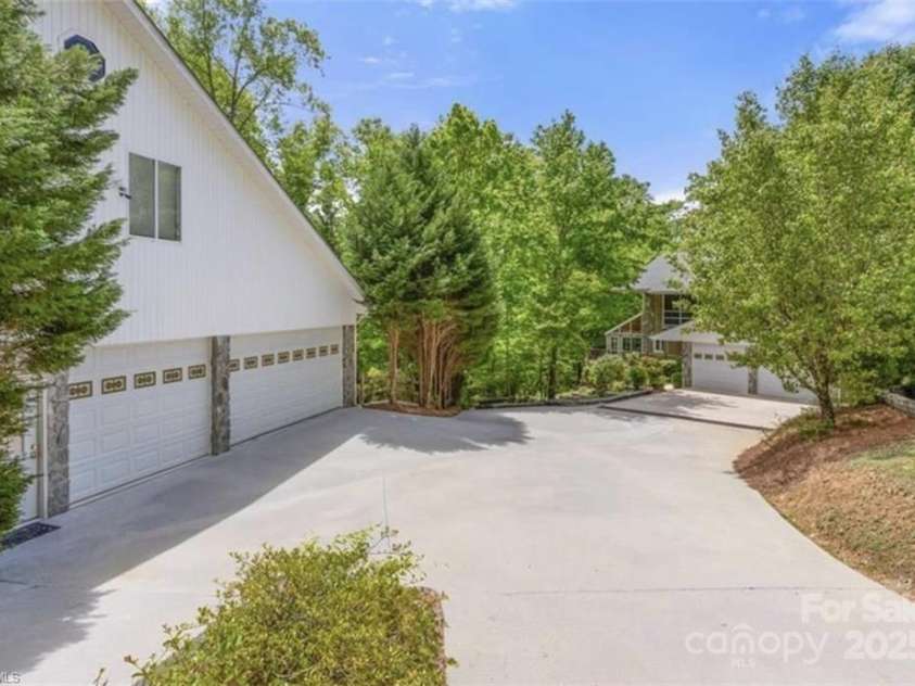 122 Mountain Harbor Drive, Lexington, NC 27292.  MLS# CAR4217597, YatesRealty ID 11172. Main waterfront home to right and Rec Center/6+ car detached/Racquetball Ct to left
