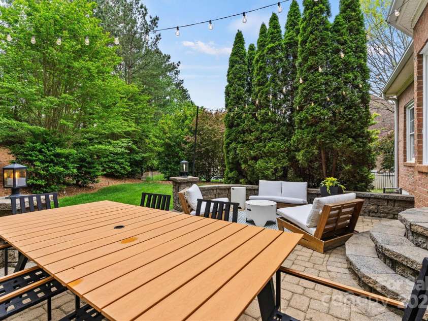 8032 Turnberry Lane, Stanley, NC 28164.  MLS# CAR4250086, YatesRealty ID 11180. Rear yard dining area