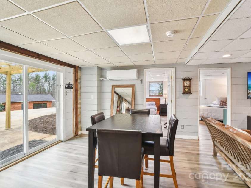 64 Alexander Road, Weaverville, NC 28787.  MLS# CAR4252153, YatesRealty ID 11181. Dining area in basement