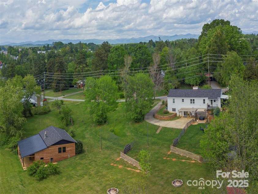 64 Alexander Road, Weaverville, NC 28787.  MLS# CAR4252153, YatesRealty ID 11181. Rear view of house and ADU