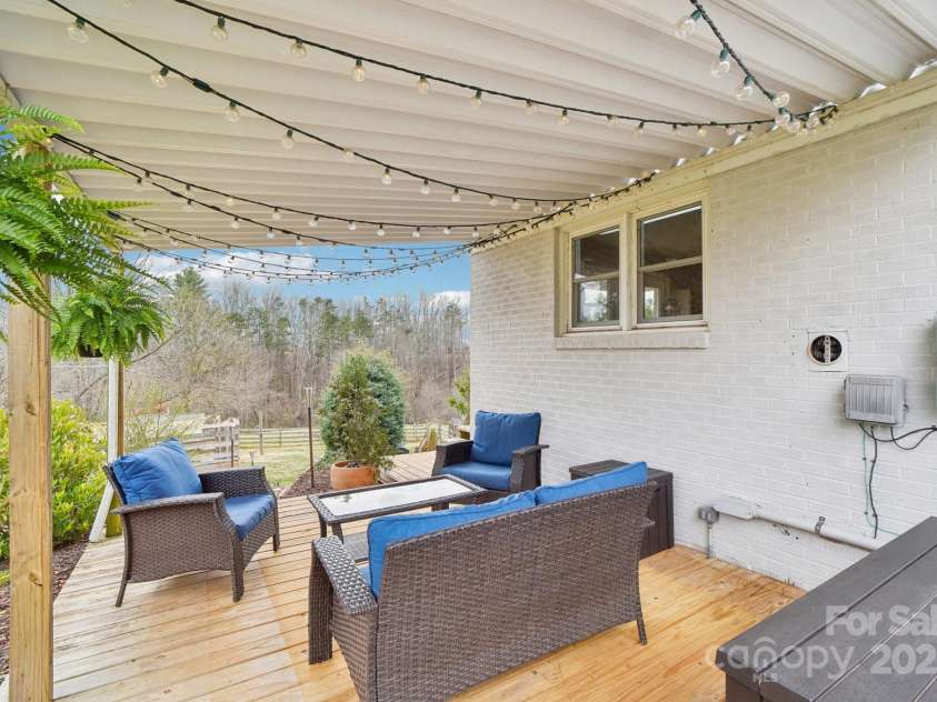 64 Alexander Road, Weaverville, NC 28787.  MLS# CAR4252153, YatesRealty ID 11181. Side patio off main level Kitchen