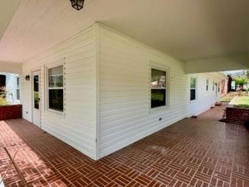 455 Spring Street, Albemarle, NC 28001.  MLS# CAR4331413, YatesRealty ID 11184. Wrap around porch 