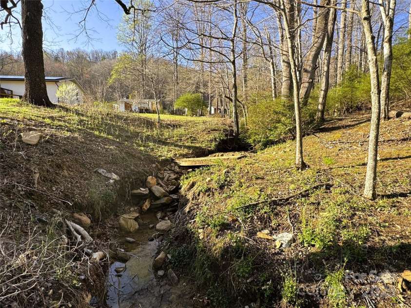 570 Brandon Road, Black Mountain, NC 28711.  MLS# CAR4241895, YatesRealty ID 11191. Creek Bordering Property