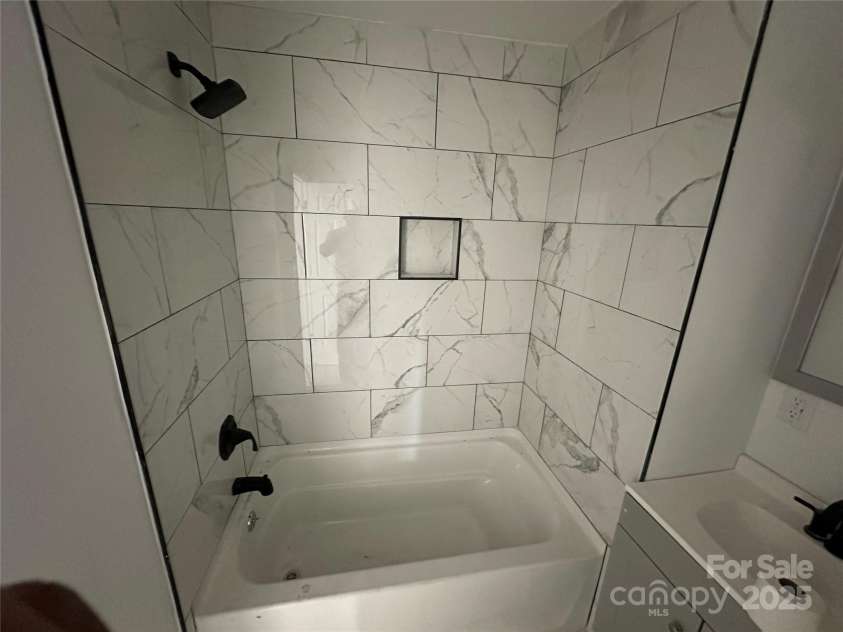 1413 Hateras Avenue, Charlotte, NC 28216.  MLS# CAR4246370, YatesRealty ID 11196. Exquisite Tilework Throughout the home