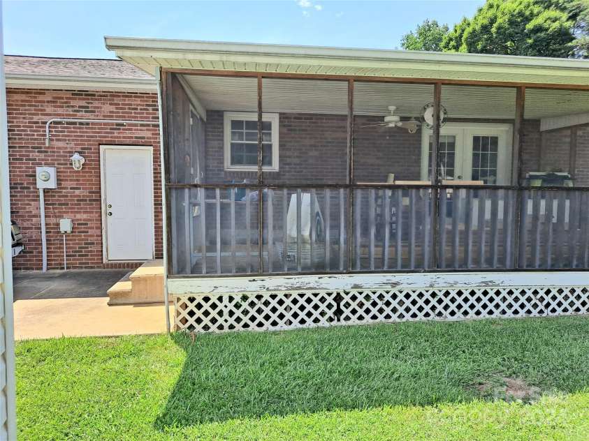 4444 Rock Barn Road, Claremont, NC 28610.  MLS# CAR4147820, YatesRealty ID 112. Enclosed back porch