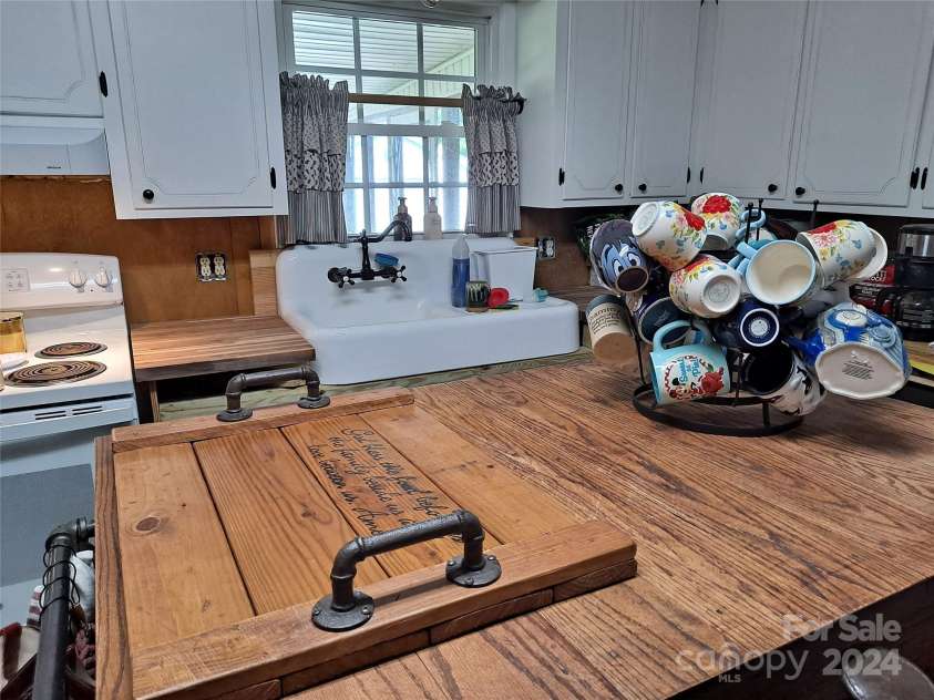 4444 Rock Barn Road, Claremont, NC 28610.  MLS# CAR4147820, YatesRealty ID 112. Farmhouse style kitchen view 1