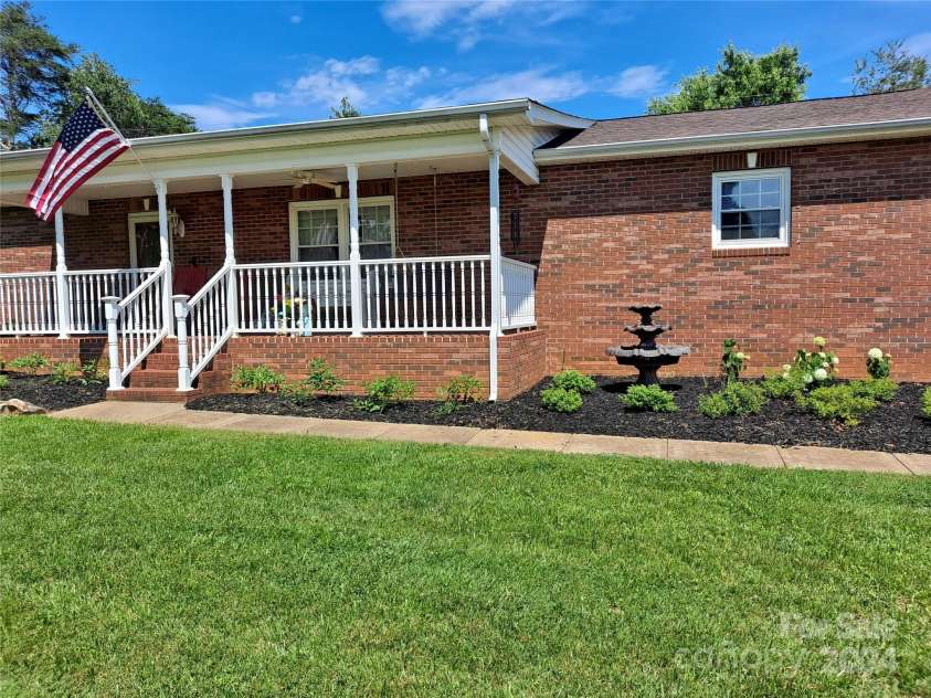 4444 Rock Barn Road, Claremont, NC 28610.  MLS# CAR4147820, YatesRealty ID 112. Front porch with room for rocking chairs!