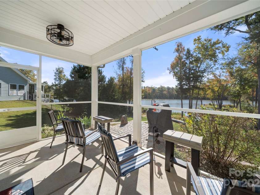 31226 Cove View Court, Lancaster, SC 29720.  MLS# CAR4253518, YatesRealty ID 11204. Screened in porch overlooking the dock and lake