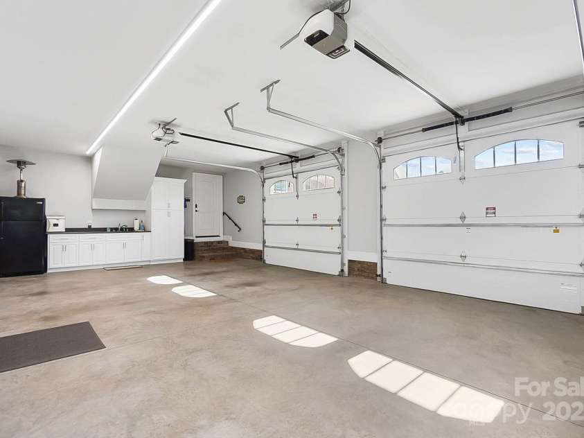 2102 Virginia Ellen Court, Stanley, NC 28164.  MLS# CAR4321172, YatesRealty ID 1121. Oversized 3 Car Garage w Custom Designed Storage Cabinets