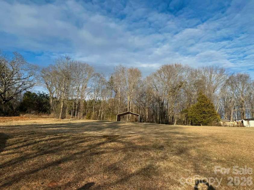 1677 US 221A Highway, Forest City, NC 28043.  MLS# CAR4340129, YatesRealty ID 11221. Expansive Back Yard