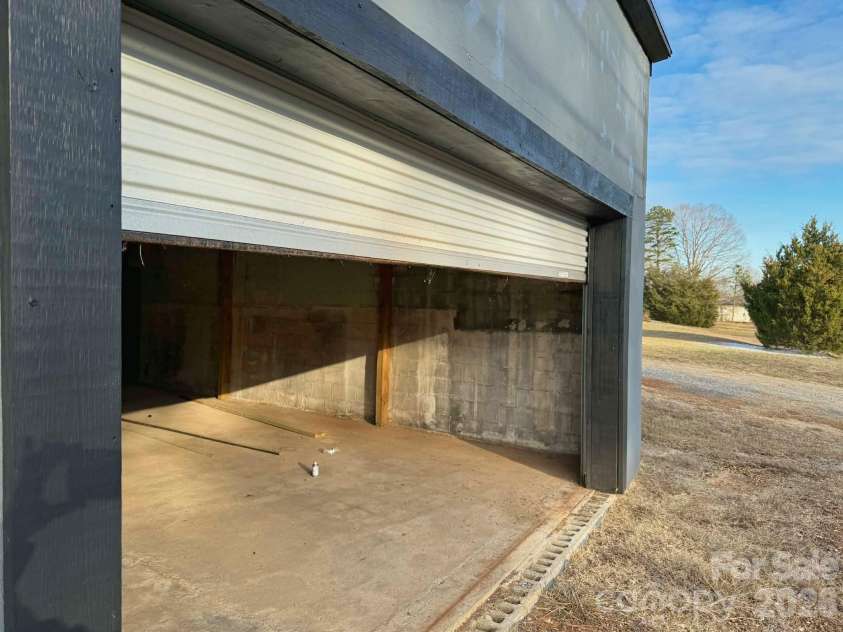 1677 US 221A Highway, Forest City, NC 28043.  MLS# CAR4340129, YatesRealty ID 11221. Shop Rollup Door