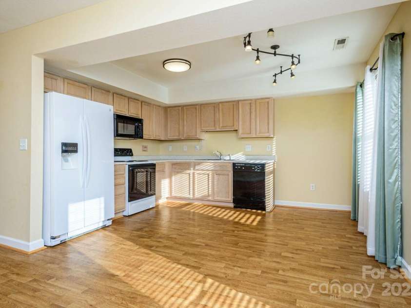 606 Olde Covington Way, Arden, NC 28704.  MLS# CAR4313907, YatesRealty ID 11222. Kitchen with Adjacent Dining