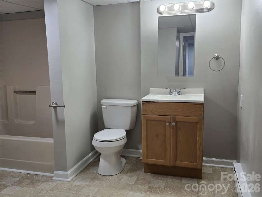 1660 Songwood Road, Concord, NC 28025.  MLS# CAR4341469, YatesRealty ID 11223. Lower level bathroom