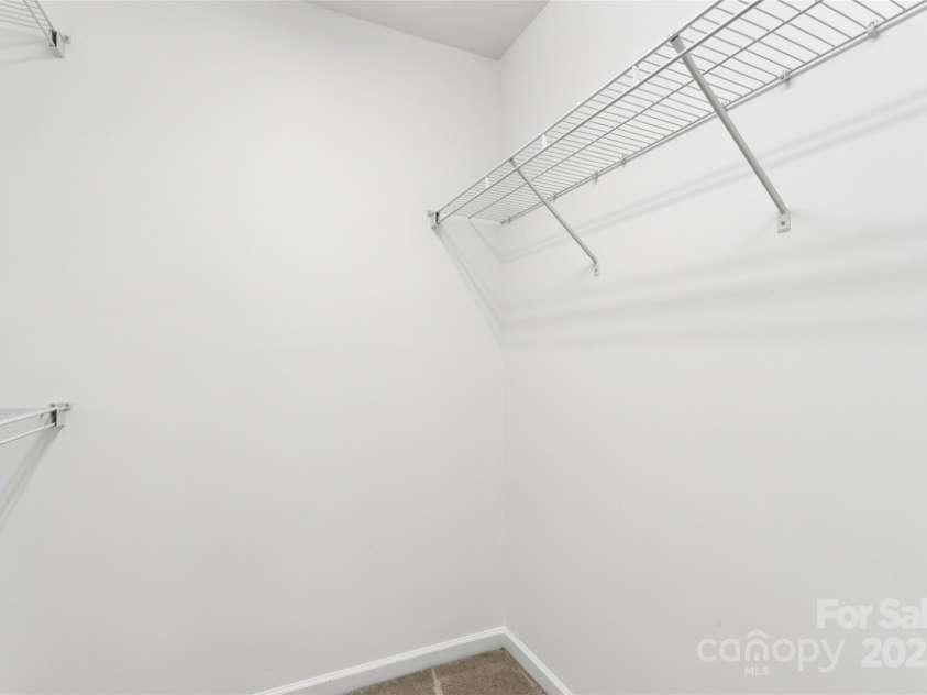 10032 Treeside Lane, Matthews, NC 28105.  MLS# CAR4329245, YatesRealty ID 11229. Primary bedroom walk-in closet