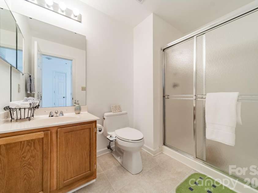 17919 Kings Point Drive, Cornelius, NC 28031.  MLS# CAR4320455, YatesRealty ID 11229. Bath #2 has a comfortable vanity and a nicely updated walk-in shower