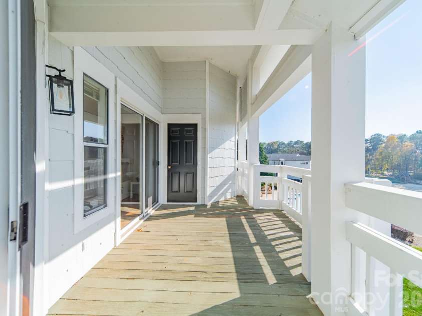 17919 Kings Point Drive, Cornelius, NC 28031.  MLS# CAR4320455, YatesRealty ID 11229. Look at the size of this beautiful deck!  Prop your feet on the railing, sip your beverage, and truly ENJOY the great view.